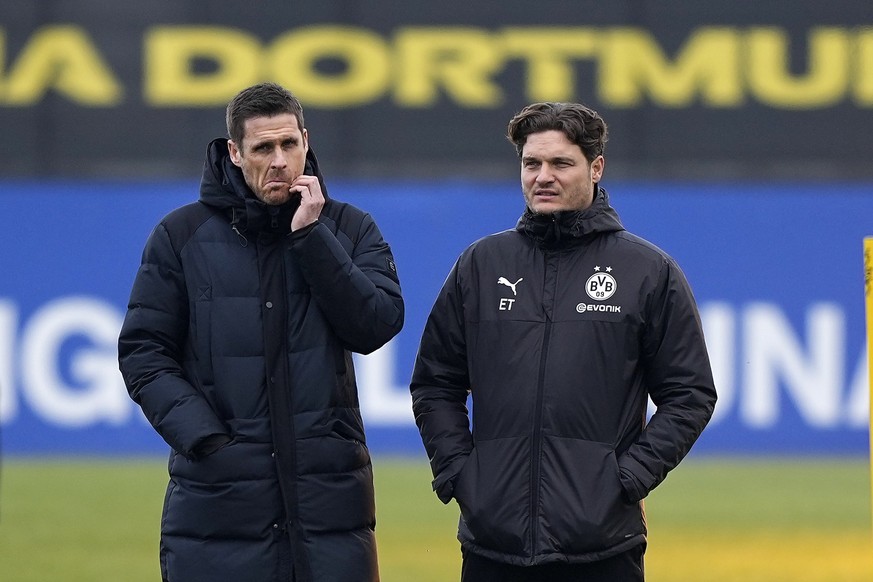 Dortmund&#039;s head coach Edin Terzic, right, stands beside sporting director Sebastian Kehl, left, during a training session ahead of the Champions League round of 16 second leg soccer match between ...