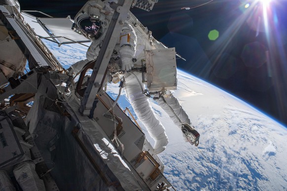 March 23, 2022, Earth Atmosphere: Astronaut Matthias Maurer of ESA (European Space Agency) is pictured on the International Space Station&#039;s truss structure during a spacewalk to install thermal g ...