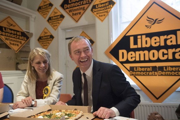 Liberal Democrats leader Tim Farron and local candidate for Bath, Wera Hobhouse (left) deliver pizza to supporters during a visit to the Lib Dem Bath headquarters during the final day of the General E ...