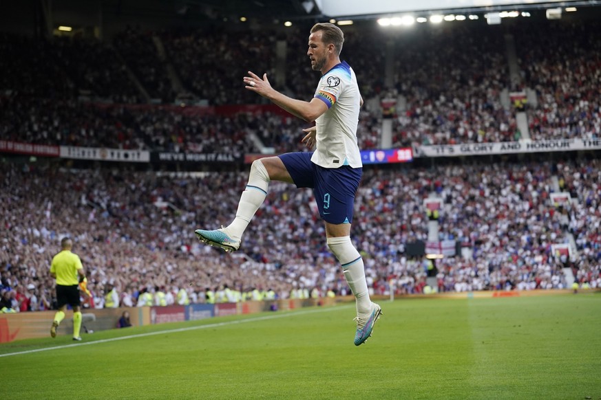 England&#039;s Harry Kane celebrates after scoring the opening goal during the Euro 2024 group C qualifying soccer match between England and North Macedonia at Old Trafford in Manchester, Monday June  ...