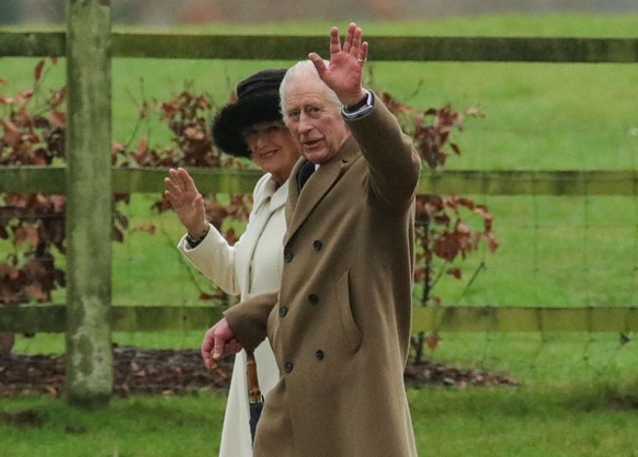 Britain&#039;s King Charles and Queen Camilla greet as they walk after attending a church service, at St. Mary Magdalene&#039;s church on the Sandringham estate in eastern England, Britain, February 1 ...