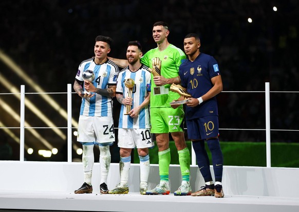 Mandatory Credit: Photo by Kieran McManus/Shutterstock 13670809hd Enzo Fernandez of Argentina, Young Player of the Tournament, Lionel Messi of Argentina, Player of the Tournament, Emiliano Martinez go ...