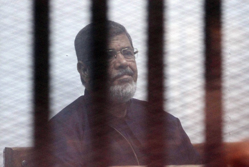 February 26, 2017 - Cairo, Cairo, Egypt - Egyptian ousted president Mohammed Morsi sits behind the defendants cage as he attends his trial at the police academy on the outskirts of the capital Cairo,  ...