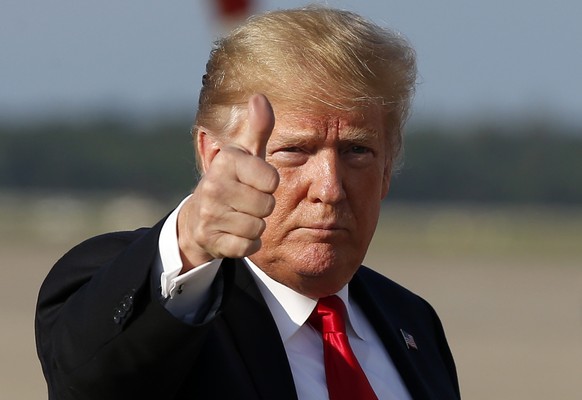 President Donald Trump gives thumbs up as he steps off Air Force One as he arrives Monday, Oct. 8, 2018, at Andrews Air Force Base, Md. Trump is returning from Orlando, Fla. Forget “Obamacare.” Presid ...