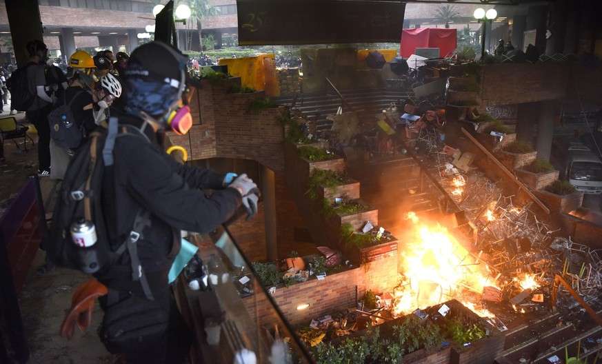 Hong Kong protest The campus of the Hong Kong Polytechnic University in the Kowloon district is on fire in the early hours of Nov. 18, 2019, after police clashed with young protesters who barricaded t ...