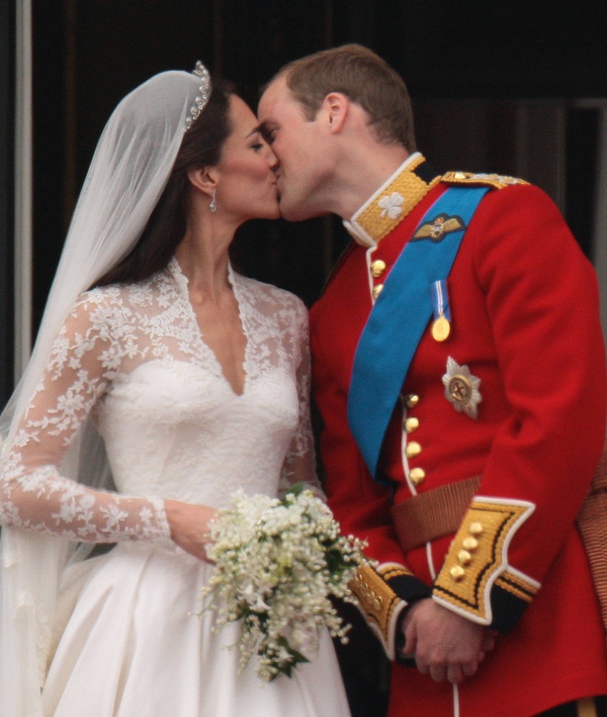 Prince William and Princess Catherine share a kiss on the balcony of Buckingham Palace after their wedding at Westminster Abbey on Friday April 29 2011 The Royal couple will now be known as the Duke a ...