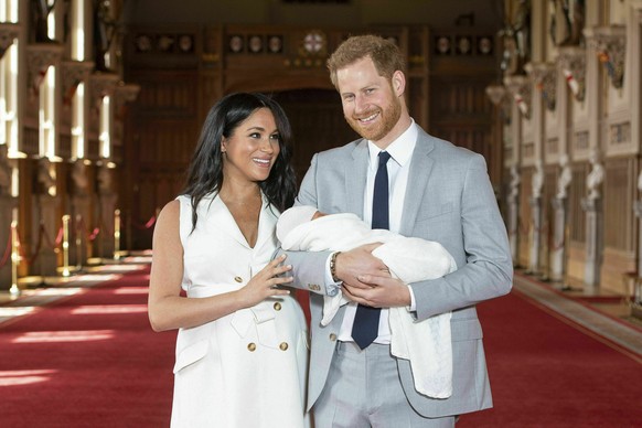 FILE - In this Wednesday May 8, 2019 file photo Britain's Prince Harry and Meghan, Duchess of Sussex, pose during a photocall with their newborn son Archie, in St George's Hall at Windsor Castle, Wind ...