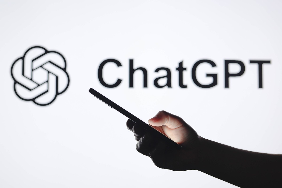 Logos displayed on smartphones in Paraguay - 05 Sept 2024 In this photo illustration, the ChatGPT logo seen in the background with a silhouette hand holding a smartphone. Paraguay Copyright: xJaquexSi ...