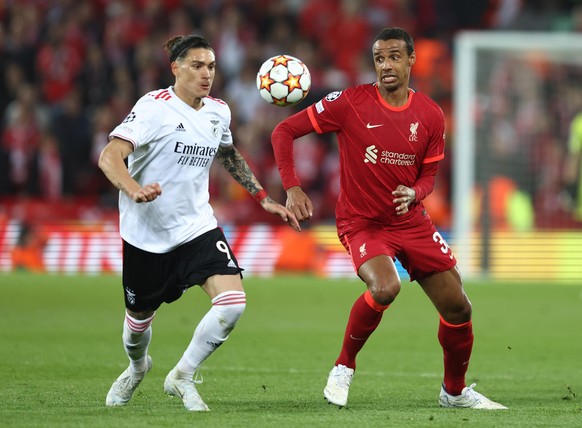 April 13, 2022, Liverpool, United Kingdom: Liverpool, England, 13th April 2022. Darwin Nunez of Benfica challenged by Joel Matip of Liverpool during the UEFA Champions League match at Anfield, Liverpo ...