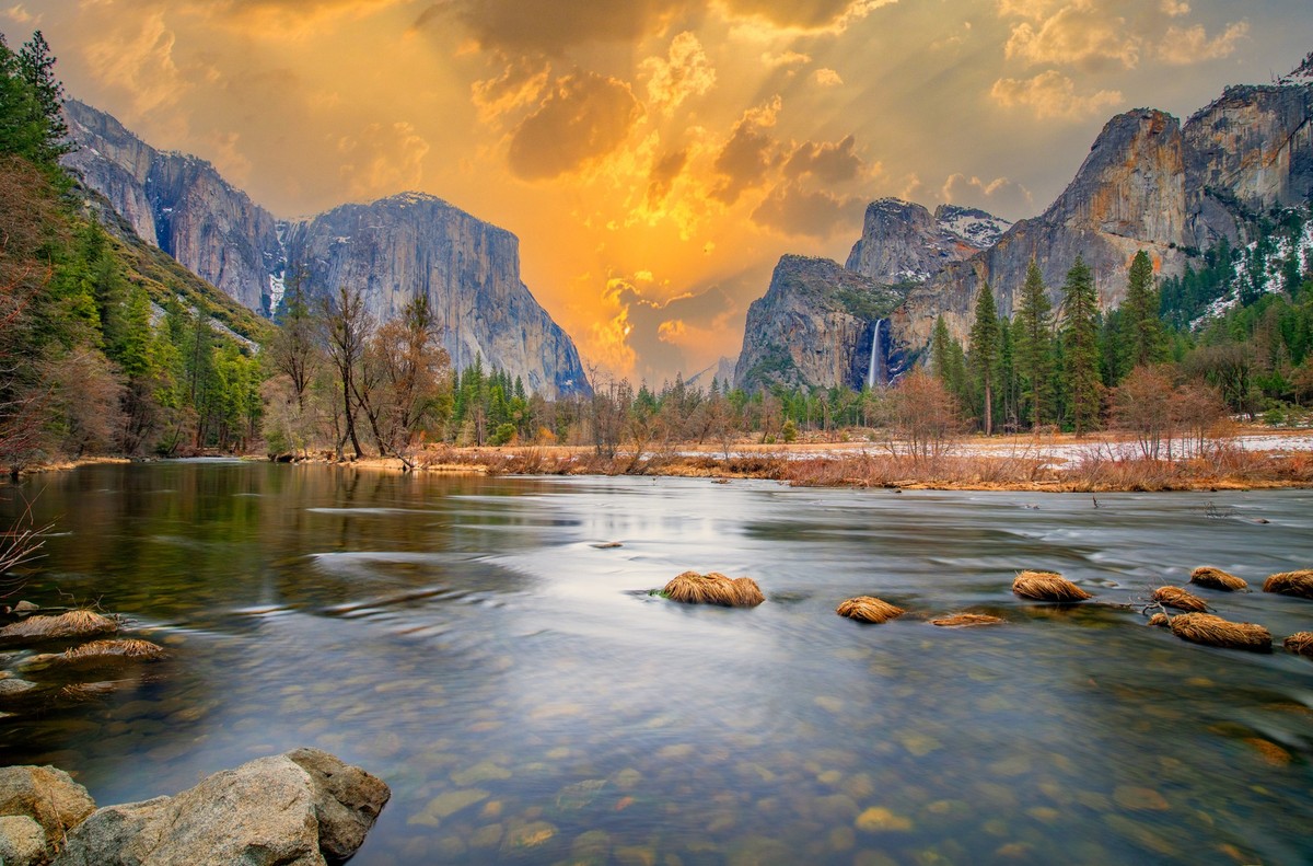beautiful view in Yosemite valley with half dome and el capitan in winter from merced river
