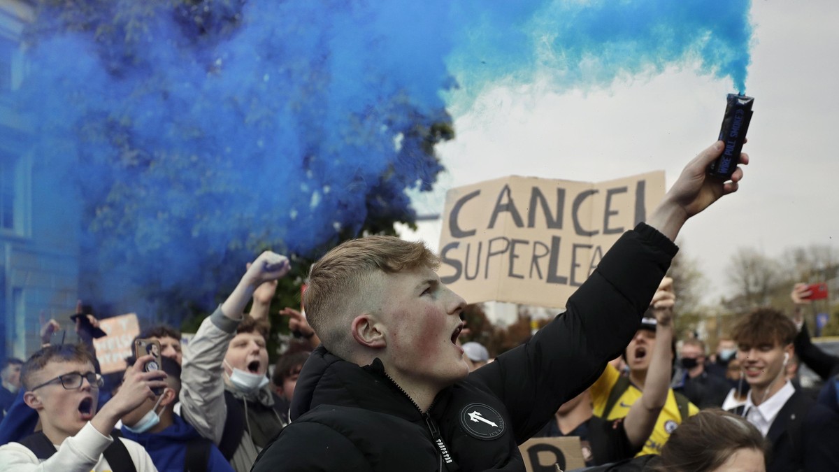 Chelsea fans protest outside Stamford Bridge stadium in London, against Chelsea's decision to be included amongst the clubs attempting to form a new European Super League, Tuesday, April 20, 2021 ...
