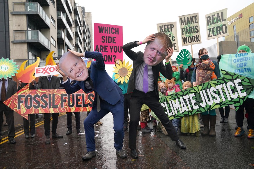 Cop26 - Glasgow. Climate Justice Activists at the Cop26 Gates asking delegates as they make final decisions, &quot;Are You With Us Or With Fossil Fuels?&quot; during the official final day of the Cop2 ...