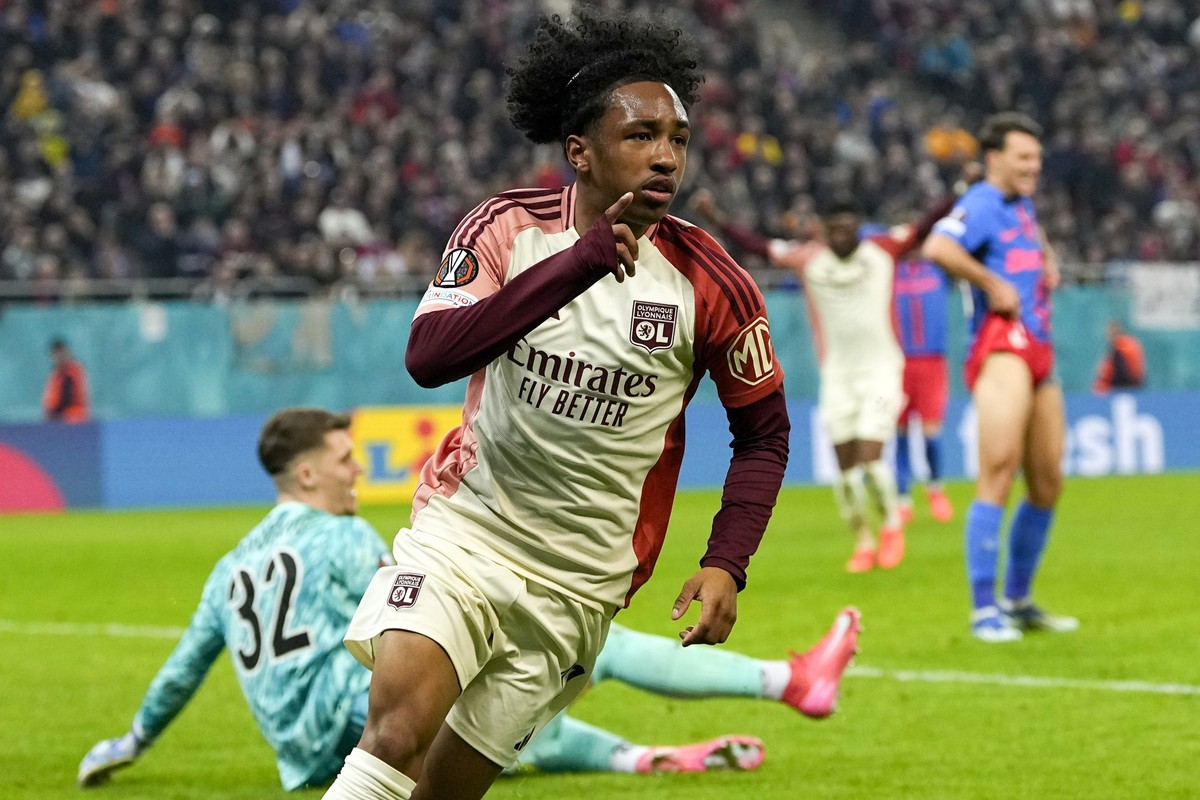 Lyon&#039;s Malick Fofana celebrates after scoring his side&#039;s second goal during the Europa League round of 16, first leg soccer match between FCSB and Lyon at the National Arena stadium, Thursda ...