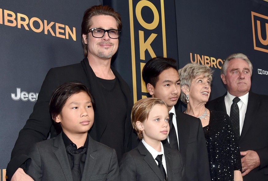 HOLLYWOOD, CA - DECEMBER 15: Actor Brad Pitt (C), (L-R) Pax Thien Jolie-Pitt, Shiloh Nouvel Jolie-Pitt,, Maddox Jolie-Pitt, Jane Pitt, and William Pitt attend the premiere of Universal Studios' &quot; ...