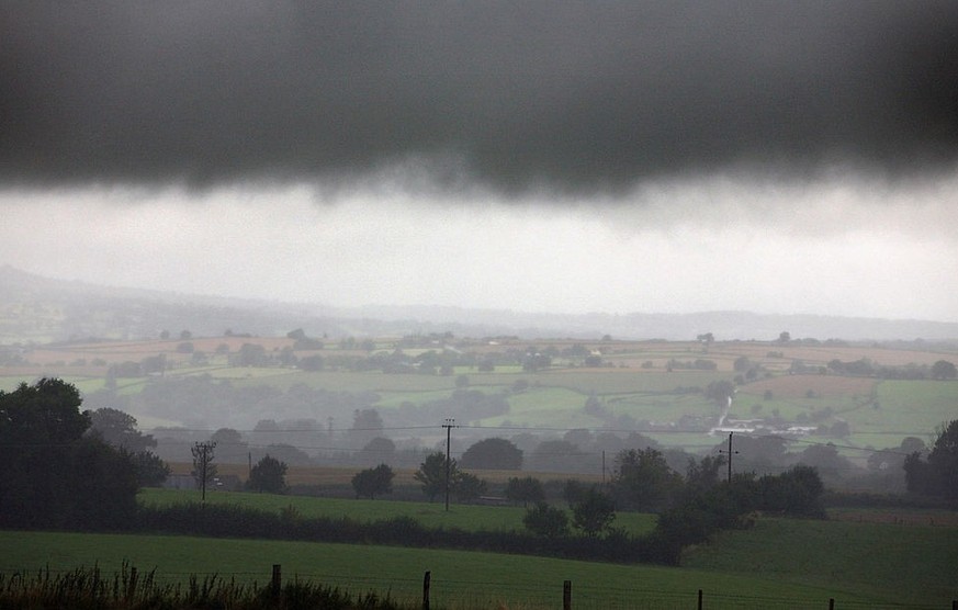 WORCESTER, UNITED KINGDOM - SEPTEMBER 06: Rain clouds gather over fields near Tenbury Wells on September 6 2008 in Worcestershire, England. Heavy rain has caused flash floods and flooding leading to w ...