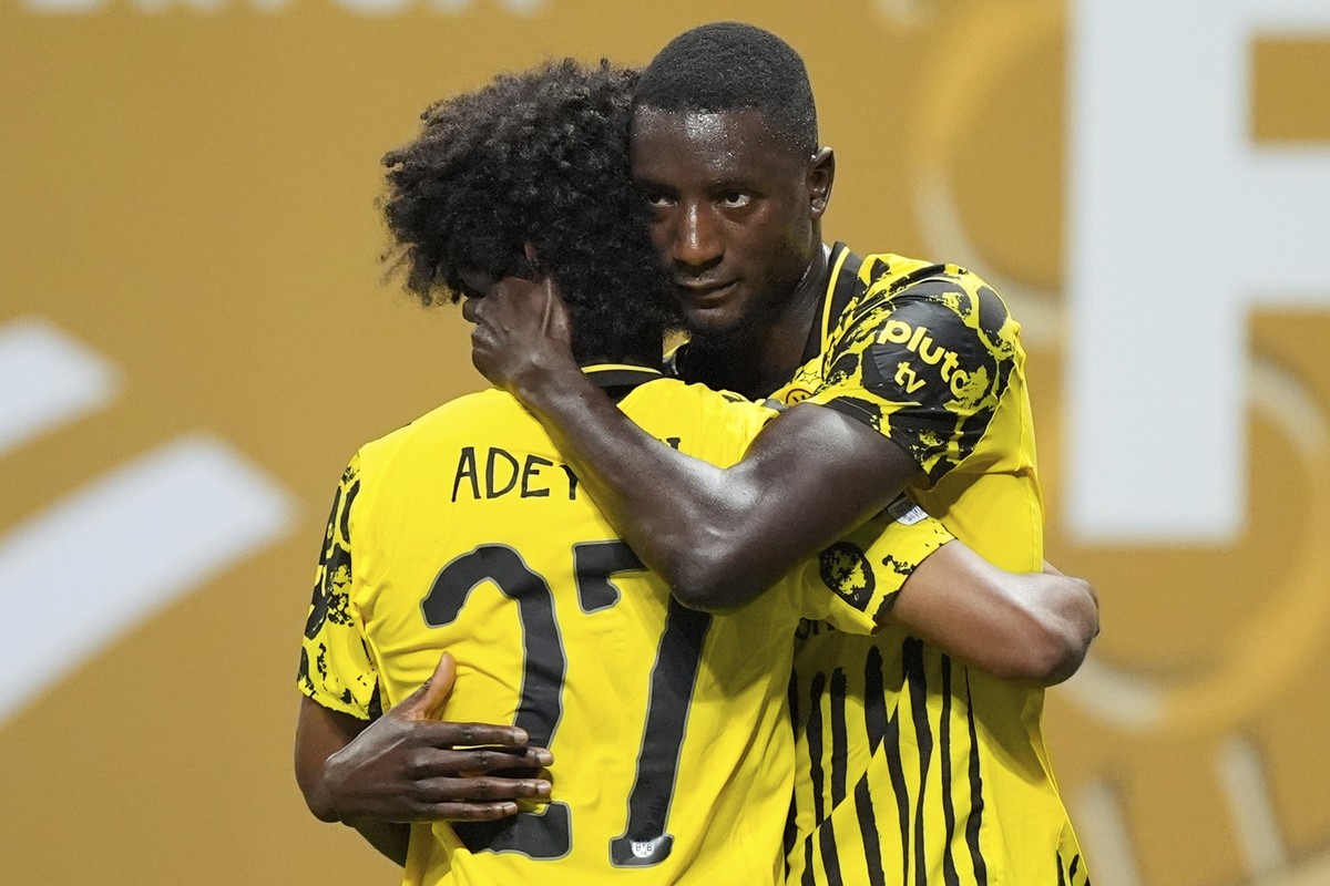 Borussia Dortmund&#039;s Serhou Guirassy, right, celebrates with teammate Karim Adeyemi after scoring his team&#039;s second goal during the Club World Cup round of 16 soccer match between Borussia Do ...