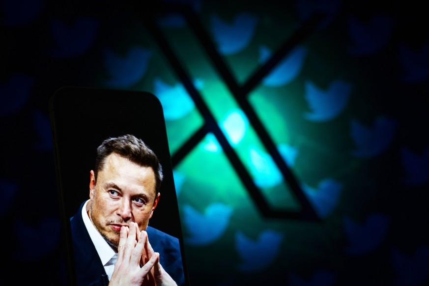 Elon Musk To Remove Block Option From X Formerly Known As Twitter An effigy of Elon Musk is seen on the screen of a mobile device with the X logo in the background in this illustration photo in Warsaw ...