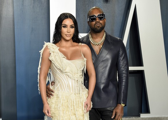 FILE -Kim Kardashian West, left, and Kanye West arrive at the Vanity Fair Oscar Party in Beverly Hills, Calif. on Feb. 9, 2020. Kim&#039;s first husband was music producer Damon Thomas, followed by a  ...