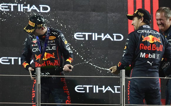 F1 Abu Dhabi Grand Prix Max Verstappen and Sergio Perez of Red Bull Racing on the podium after the Formula 1 Abu Dhabi Grand Prix at Yas Marina Circuit in Abu Dhabi, United Arab Emirates on November 2 ...