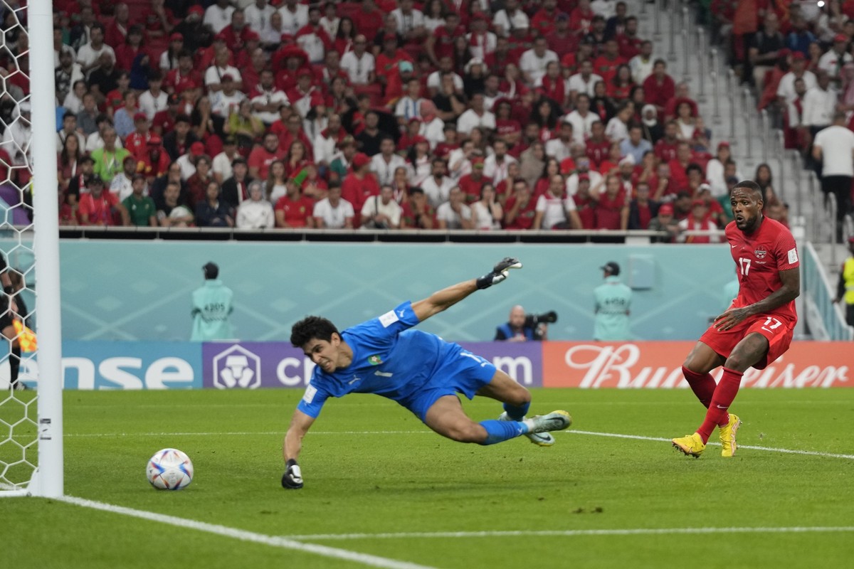 Morocco&#039;s goalkeeper Yassine Bounou, left, fails to stop an own goal by Morocco&#039;s Nayef Aguerd, not seen, as Canada&#039;s Cyle Larin looks on during the World Cup group F soccer match betwe ...