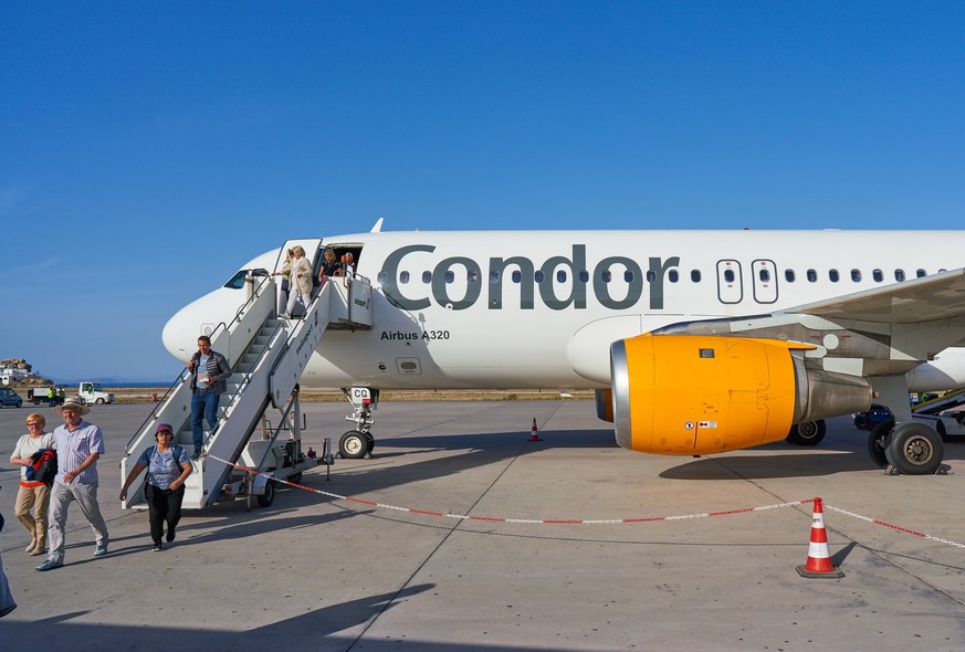 Tourists in a Condor aero plane at Santorini airport near Oia, Santorini , Greece at 30.05.19. Photographer: Peter Schatz