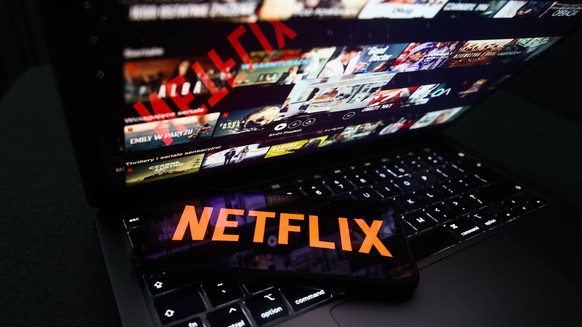 Popular Streaming Services Photo Illustrations Netflix logo displayed on a phone screen and Netflix website displayed on a laptop screen are seen in this illustration photo taken in Krakow, Poland on  ...
