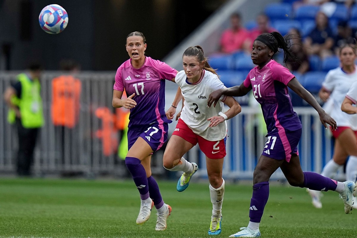 United States&#039; Emily Fox fights for the ball with Germany&#039;s Klara Buehl during a women&#039;s semifinal soccer match between the United States and Germany at the 2024 Summer Olympics, Tuesda ...