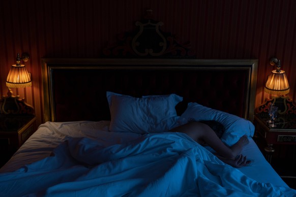 Unrecognizable person sleeping in bed Copyright: FrédéricxCirou B99446846 RECORD DATE NOT STATED