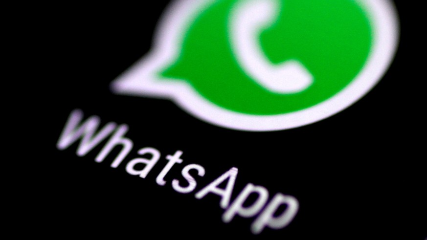 FILE PHOTO: The WhatsApp messaging application is seen on a phone screen August 3, 2017. REUTERS/Thomas White/File Photo