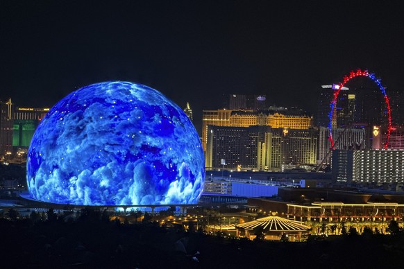 The MSG Sphere illuminates the Las Vegas skyline with a display to celebrate Independence Day as the Exosphere is fully lit up for the first time, as seen from the Metropolis, on Tuesday, July 4, 2023 ...