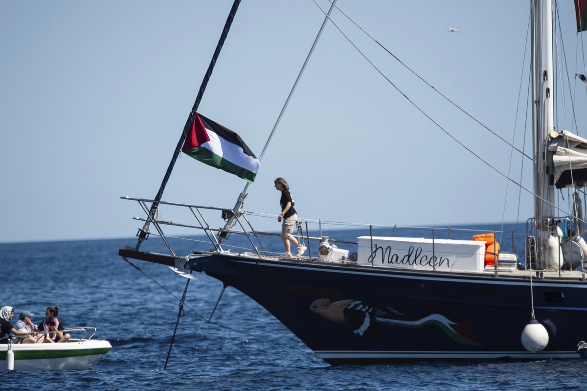 Climate activist Greta Thunberg boards the Madleen boat before setting sail for Gaza along with activists of the Freedom Flotilla Coalition, departing from the Sicilian port of Catania, Italy, Sunday, ...