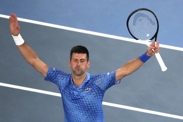 Novak Djokovic of Serbia celebrates after defeating Tommy Paul of the U.S. in their semifinal at the Australian Open tennis championship in Melbourne, Australia, Friday, Jan. 27, 2023. (AP Photo/Ng Ha ...
