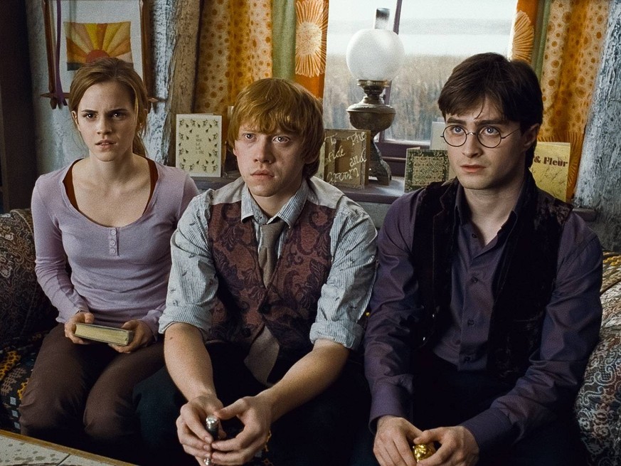 (L-r) EMMA WATSON as Hermione Granger, RUPERT GRINT as Ron Weasley and DANIEL RADCLIFFE as Harry Potter in Warner Bros. Pictures