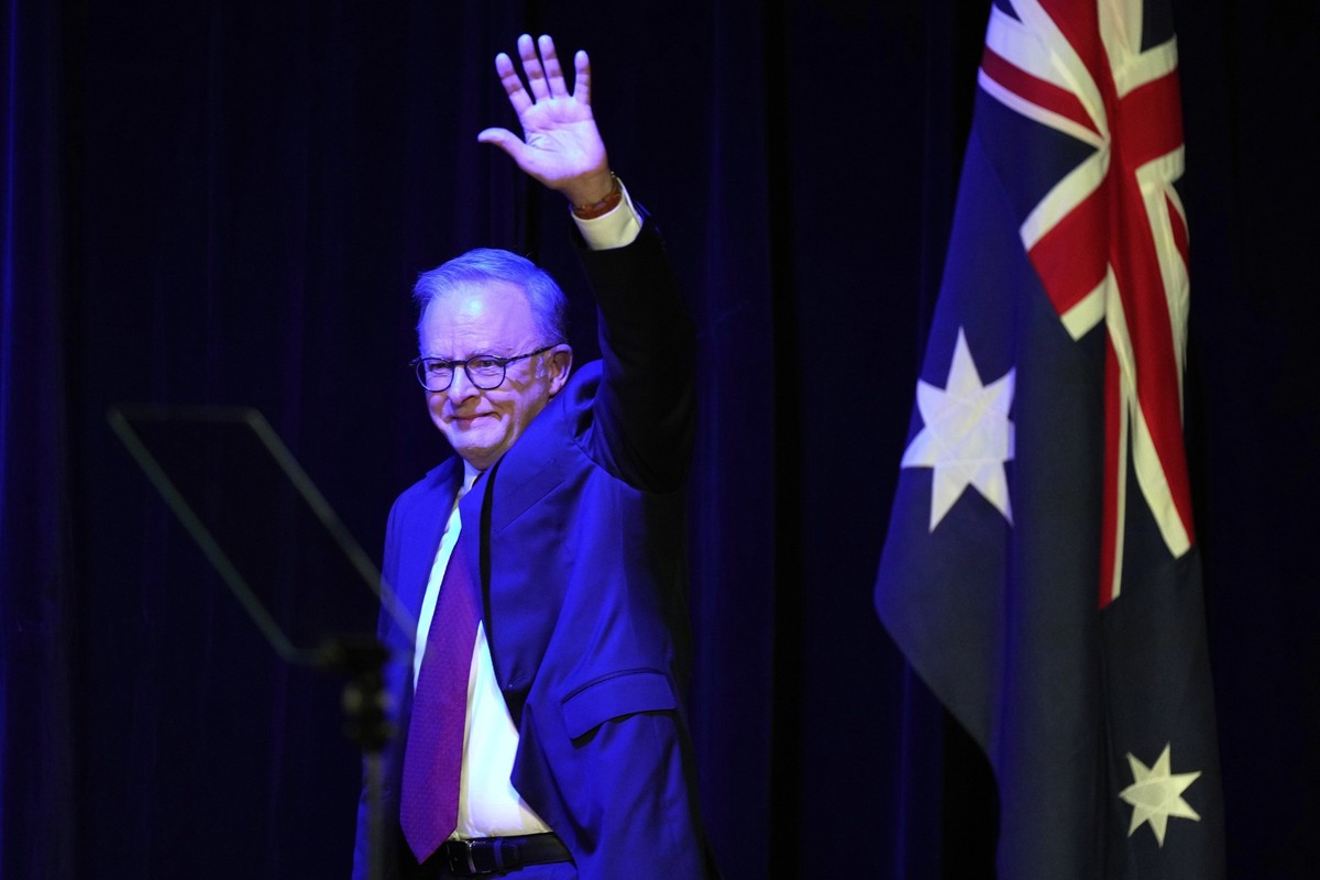 Australian Prime Minister Anthony Albanese waves as he prepares to address the party faithful after winning a second term following the general election in Sydney, Saturday, May 3, 2025. (AP Photo/Ric ...