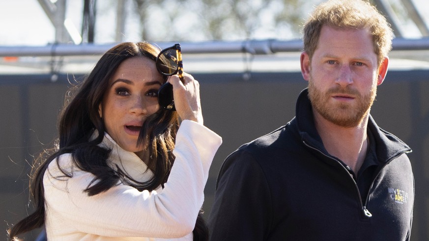 FILE - Prince Harry and Meghan Markle, Duke and Duchess of Sussex visit the track and field event at the Invictus Games in The Hague, Netherlands, Sunday, April 17, 2022. The production company founde ...