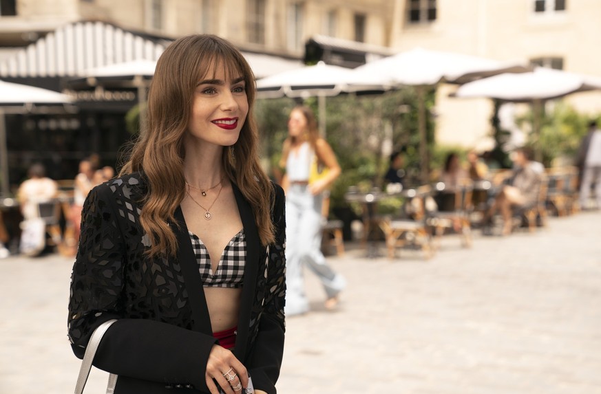 Emily In Paris. Lily Collins as Emily in episode 305 of Emily In Paris. Cr. Stéphanie Branchu/Netflix © 2022