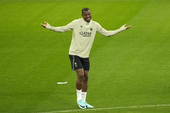 PSG&#039;s Nordi Mukiele reacts during a training session ahead of the Champions League Group F soccer match between Borussia Dortmund and Paris Saint-Germain in the Signal Iduna Park in Dortmund, Ger ...
