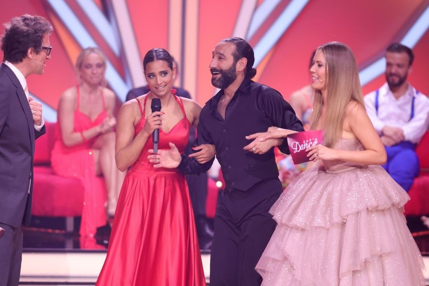 COLOGNE, GERMANY - MAY 13: Daniel Hartwich, Amira Pocher, Massimo Sinató and Victoria Swarovski are seen on stage during the 11th show of the 15th season of the television competition show &quot;Let&# ...