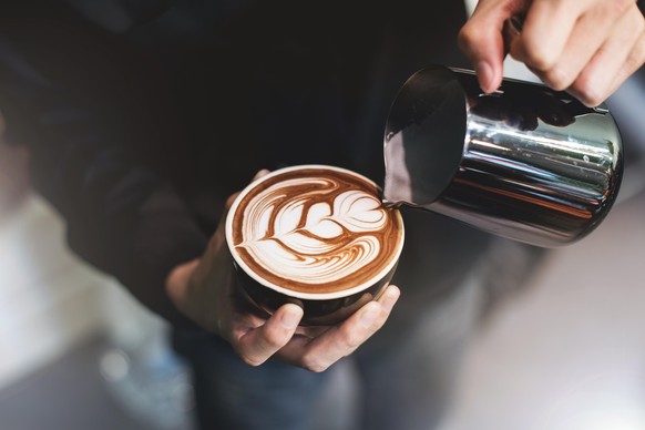 Barista make coffee cup latte art