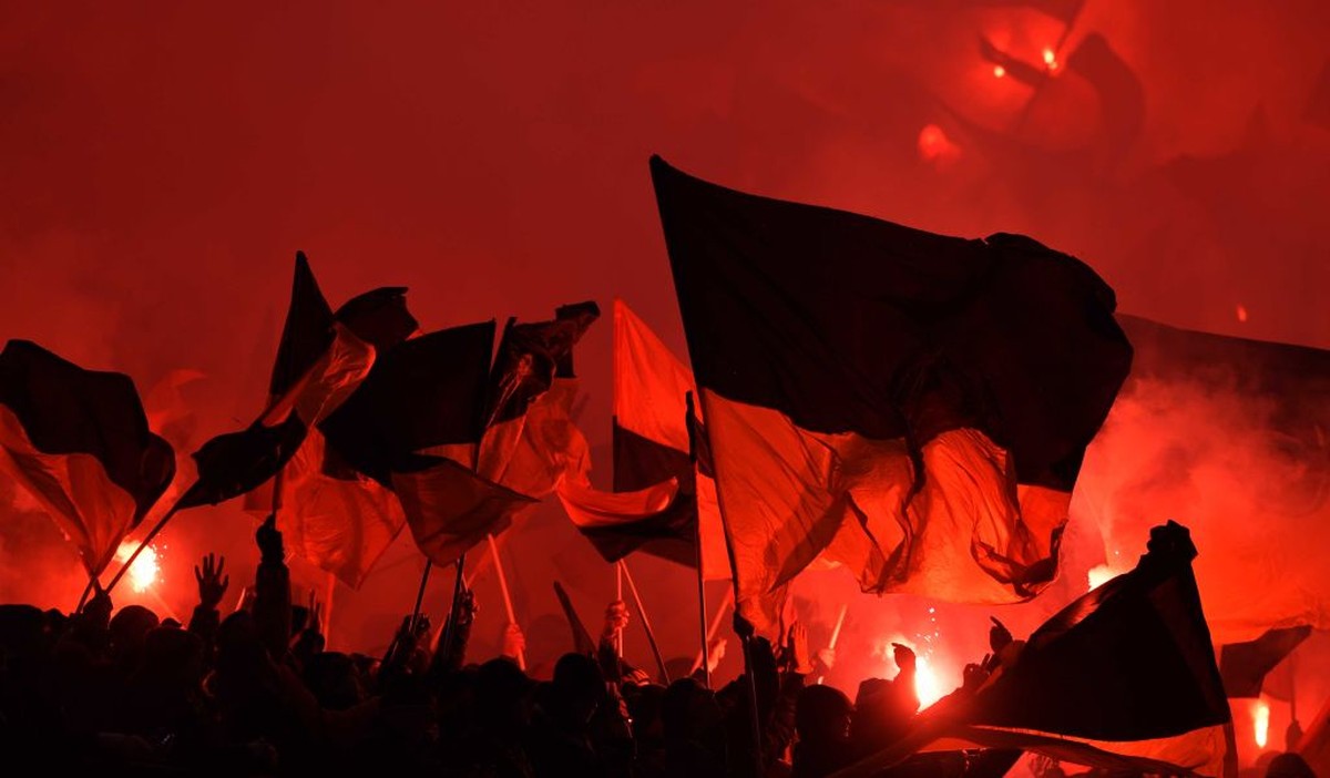 HAMBURG, GERMANY - FEBRUARY 11: Fans of Dresden burn flares during the Second Bundesliga match between Hamburger SV and SG Dynamo Dresden at Volksparkstadion on February 11, 2019 in Hamburg, Germany.  ...