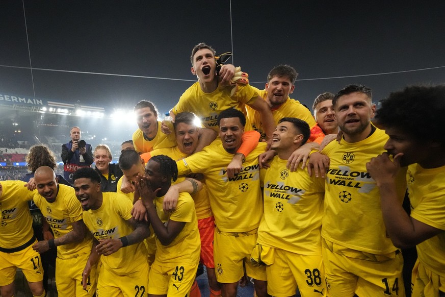 Borussia Dortmund players celebrate at the end of the Champions League semifinal second leg soccer match between Paris Saint-Germain and Borussia Dortmund at the Parc des Princes stadium in Paris, Fra ...