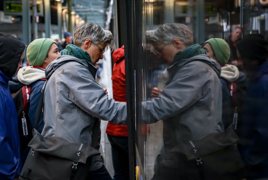 MUNICH, GERMANY - MARCH 27: Passangers get onto a crowded bus at Munich Ostbahnhof railway station during a nationwide strike on March 27, 2023 in Munich, Germany. Air travel and long distance rail se ...