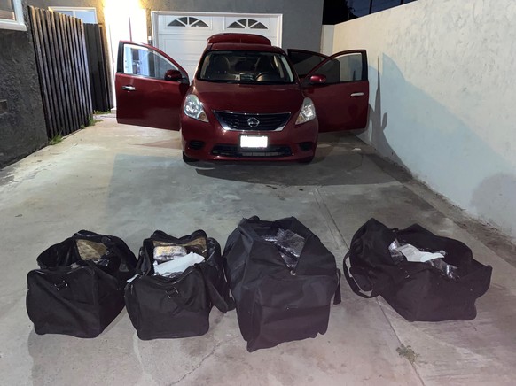 This undated photo provided by the U.S. Drug Enforcement Administration, Los Angeles Field Division, shows bags of some of the seized approximately 1 million fake pills containing fentanyl that were s ...
