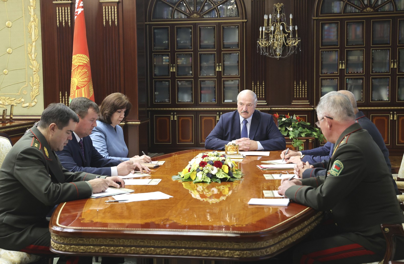 Belarus President Alexander Lukashenko, center, with officials, attends the meeting of the Security Council in Minsk, Belarus, Wednesday, July 29, 2020. Belarusian authorities said Wednesday they have ...