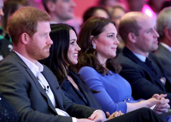 Duke and Duchess of Sussex book. File photo dated 28/02/18 of (left to right) the Duke and Duchess of Sussex with the Duke and Duchess of Cambridge. A new book on Harry and Meghan has described how re ...