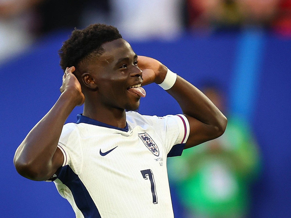 England v Switzerland 6 July 2024, Dusseldorf - UEFA EUROs - Quarter-Final - England v Switzerland - Bukayo Saka of England celebrates scoring his penalty during the shoot-out - Photo: Charlotte Wilso ...