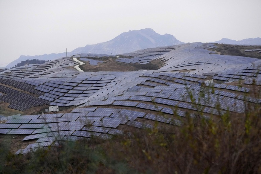 A solar farm sits next to Donggou village near Shijiazhuang city in northern China&#039;s Hebei province, Friday, Nov. 10, 2023. (AP Photo/Ng Han Guan)