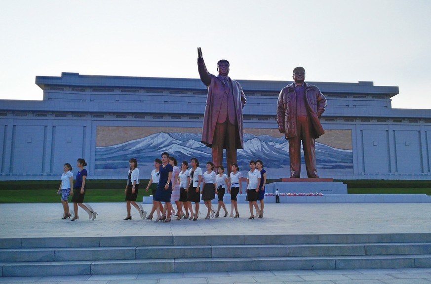 PYONGYANG, NORTH KOREA - AUGUST 23: North Koreans visit the Mansudae Grand Monument on August 23, 2015 in Pyongyang, North Korea. North and South Korea today came to an agreement to ease tensions foll ...