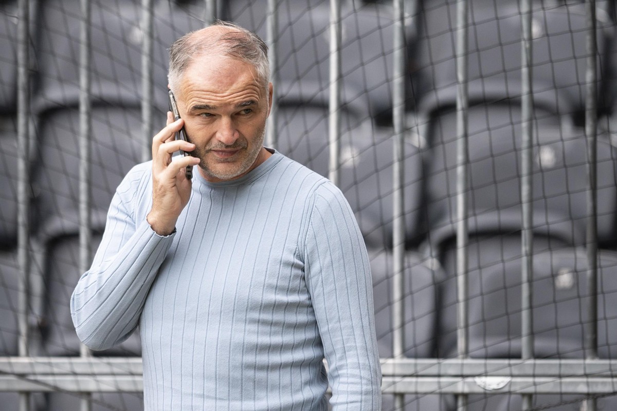 YB&#039;s chief scout and former international player Stephane Chapuisat talks on the telephone during a training session ahead of Wednesday&#039;s UEFA Champions League Play-off first leg soccer matc ...