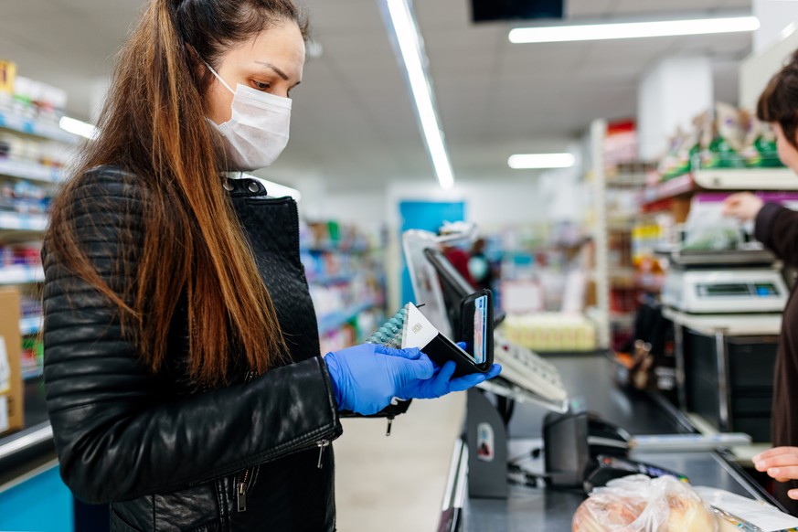 little girl wearing a mask and gloves going out shopping in Grocery Store